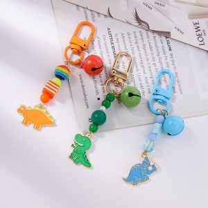 Colorful beaded dinosaur keychains with bells and enamel charms for bags and keys