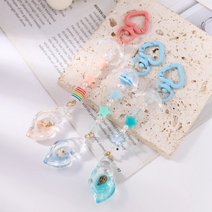 Beaded keychain with resin starfish and shell charms on heart-shaped clip