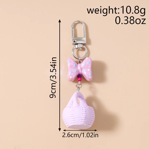 Detailed dimensions of purple polka dot bow keychain with weight 10.8g and 9cm length