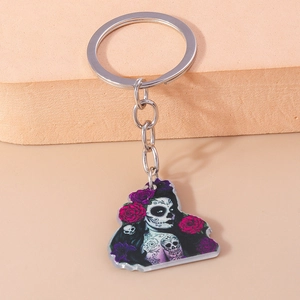 Close-up of acrylic keychain featuring Sugar Skull girl with purple roses