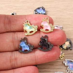 Macro shot of unicorn horse charms with colorful resin inlay for DIY jewelry making