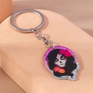Detailed macro of Day of the Dead girl acrylic keychain with silver metal ring