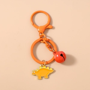 Close-up of orange stegosaurus keychain with red bell and durable metal lobster clasp