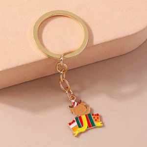 Porte-clés de Noël renne dans boîte cadeau avec anneau doré et pendentif en émail coloré