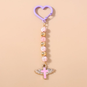 Detail of pink beaded keychain with heart clasp, wing cross pendant and pastel beads