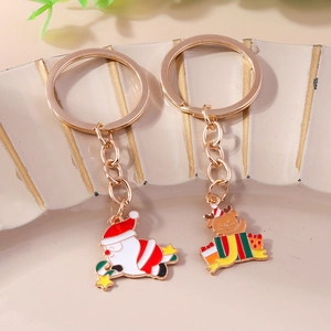 Porte-clés de Noël avec renne et Père Noël avec placage doré au style festif élégant
