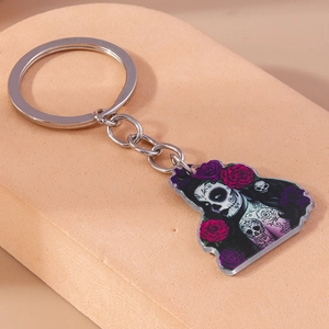 Detailed close-up of Sugar Skull keychain with vibrant roses and silver metal chain