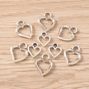 Set di ciondoli a forma di cuore cavo in metallo argentato per creazione gioielli fai da te