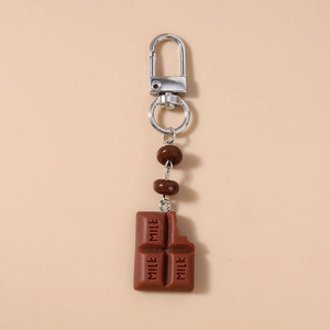 Detailed close-up of realistic milk chocolate keychain with silver lobster clasp and brown beads