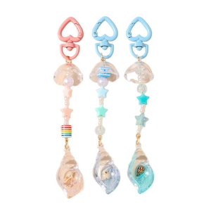 Ocean themed keychain set with star beads, jellyfish charms and resin seashell pendants