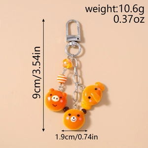 Detail view of cute animal bear bread keychain showing dimensions 9cm and 10.6g weight
