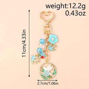 Dimensions détaillées du porte-clés colibri floral bleu avec fermoir coeur en émail