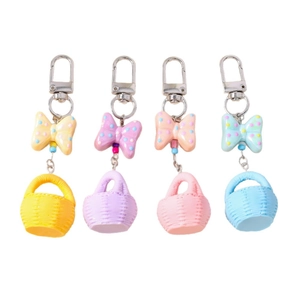 Set of four pastel macaron bow keychains with mini woven baskets in various colors