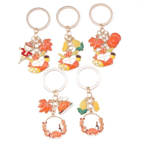 Five-piece Thanksgiving keychain set with turkey, pumpkin, and maple leaf charms