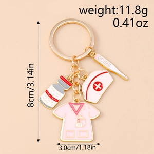 Nurse keychain with pink scrub suit, hat, and thermometer charm detailing 8cm length