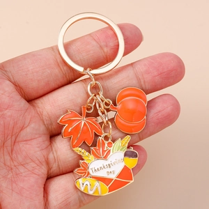 Thanksgiving keychain with orange maple leaf, pumpkin, and envelope charm for holiday gift