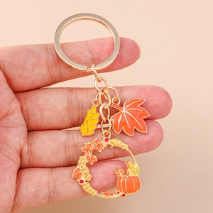 Autumn wreath keychain with orange maple leaf, pumpkin ring and golden wheat ear charms