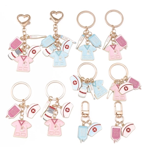 Nurse themed medical keychain set with pink and blue uniforms and thermometers