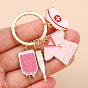 Creative nurse theme keychain with gold ring, medical charms and thermometer pendant
