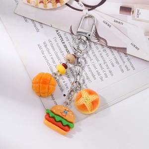 Detailed view of cute resin food pendants including burger and bread keychain