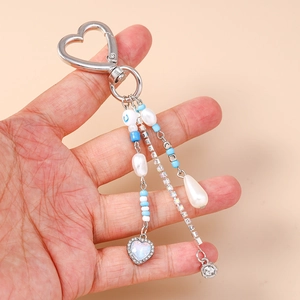 Beaded heart keychain with turquoise beads, baroque pearls, and rhinestone charms