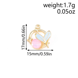 Detail of 17mm x 15mm gold alloy fish tail charm with blue enamel and pink bead