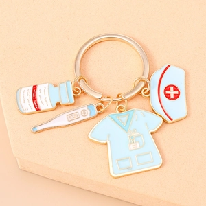 Detailed view of medical charms keychain featuring nurse cap, uniform and thermometer