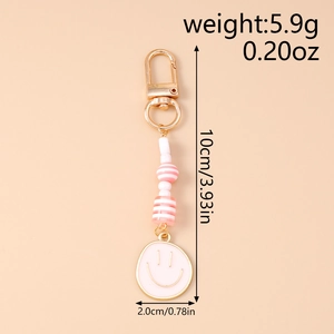 Pink smiley face keychain detail with dimensions 10cm length and 5.9g lightweight metal clasp