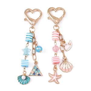 Ocean themed keychains set with shell starfish and whale pendants in pink and blue colors