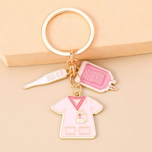 Nurse theme keychain detail with miniature medical scrub, thermometer and pink IV bag