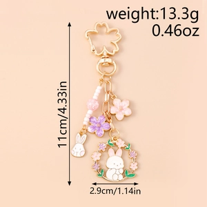 Detailed size map of sakura flower bunny keychain with measurements in cm and inches