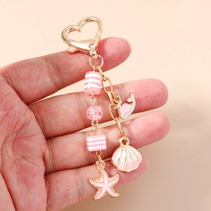 Pink ocean seashell starfish and whale keychain with gold heart clasp and beads