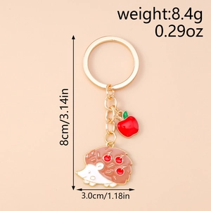 Detailed view of hedgehog keychain with red apple charm and size measurement indicators