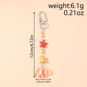 Detail view of clownfish and starfish charm keychain with exact dimensions and weight