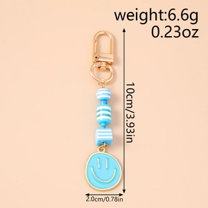 Detail showing dimension and weight of blue smiley face beaded metal keychain