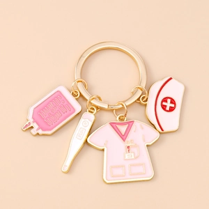 Detailed medical themed keychain with pink nurse uniform, thermometer and IV bag charms