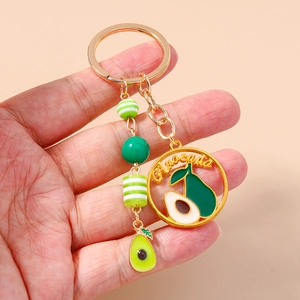 Avocado themed metal keychain featuring green beads and engraved hollow gold letter charm