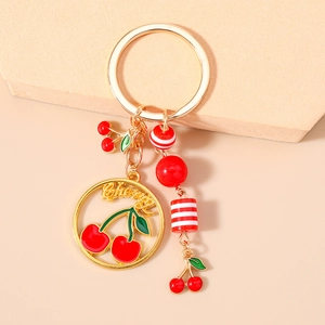 Golden cherry fruit keychain with letter ring and red enamel pendants for handbag charm
