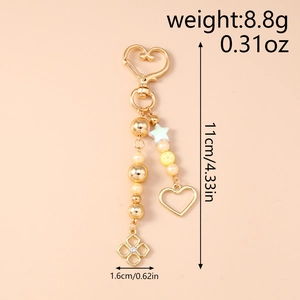 Detailed view of beaded heart keychain with measurements and gold-tone charms