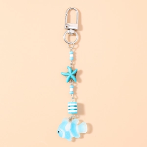 Close-up of ocean-themed starfish and fish keychain with blue beads and silver clasp