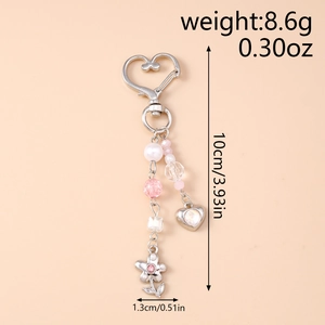 Détails des dimensions du porte-clés à perles avec pendentif fleur en strass rose
