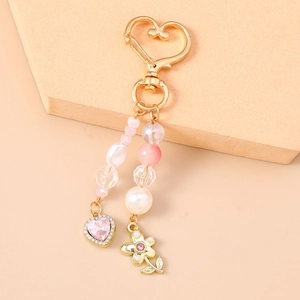 Porte-clés perles roses avec cœur et fleur, fermoir doré élégant pour accessoires