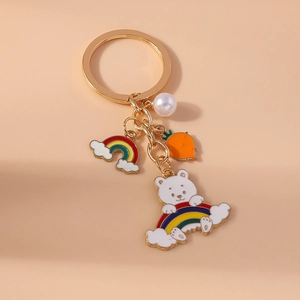 Rainbow bear keychain with pearl and carrot charm on golden metal ring for bag decoration