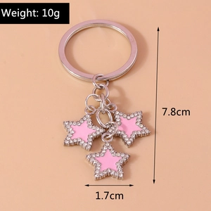 Pink star-shaped keychain with crystal embellishments and 7.8cm size measurements