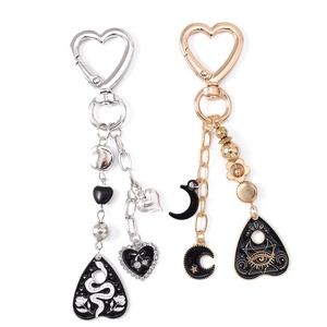 Gothic and Bohemian rhinestone heart keychains with snake and celestial charms