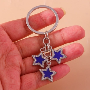 Silver star keychain with blue enamel pendants and sparkling rhinestones for handbags