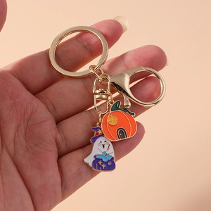 Halloween keychain with cute white ghost in wizard hat and orange pumpkin house pendant
