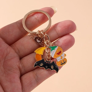Cute Halloween keychain set with pumpkin, spider, bat and moon charms on gold ring