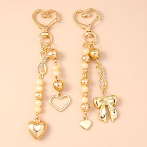 Fashion golden keychain with bowknot, pearls and heart charms for handbag decoration