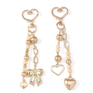 Golden heart keychain set with bow, pearls, rhinestones and infinity charm for bags